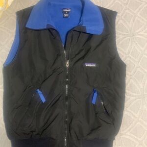 Patagonia Vest size small black with blue fleece lining.